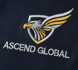 Close-up of a business logo embroidered on a polo shirt, highlighting the texture and professional finish of custom embroidery branding.