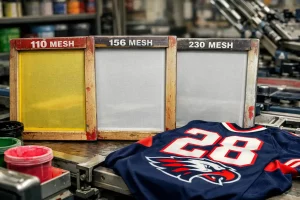 Close-up of silk screen printing mesh stretched on frame for sports jersey printing with visible mesh count detail